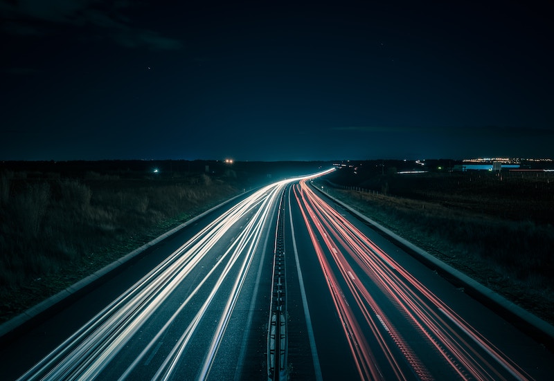 Illuminated highway traffic at night